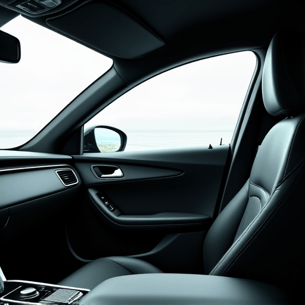 Interior view of a car with ceramic window tint, highlighting reduced glare and improved clarity compared to an untinted window, emphasizing comfort and protection.